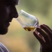 a man experiencing the aroma of whisky