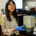Luyao Ma and In-Hwan Lee holding an avocado in their lab